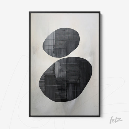 abstract wall art in black and white featuring oval shapes on a light background with a black frame