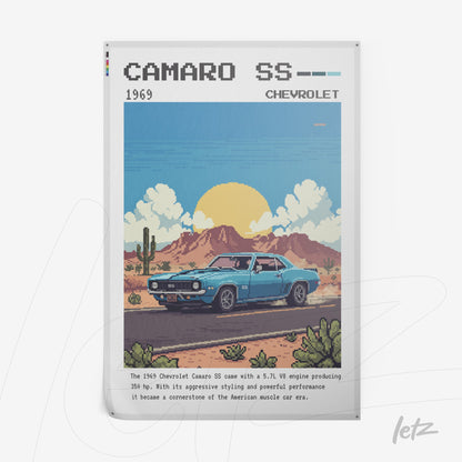 framed digital artwork of a 1969 chevrolet camaro ss in a desert scene featuring mountains and cacti under a blue sky
