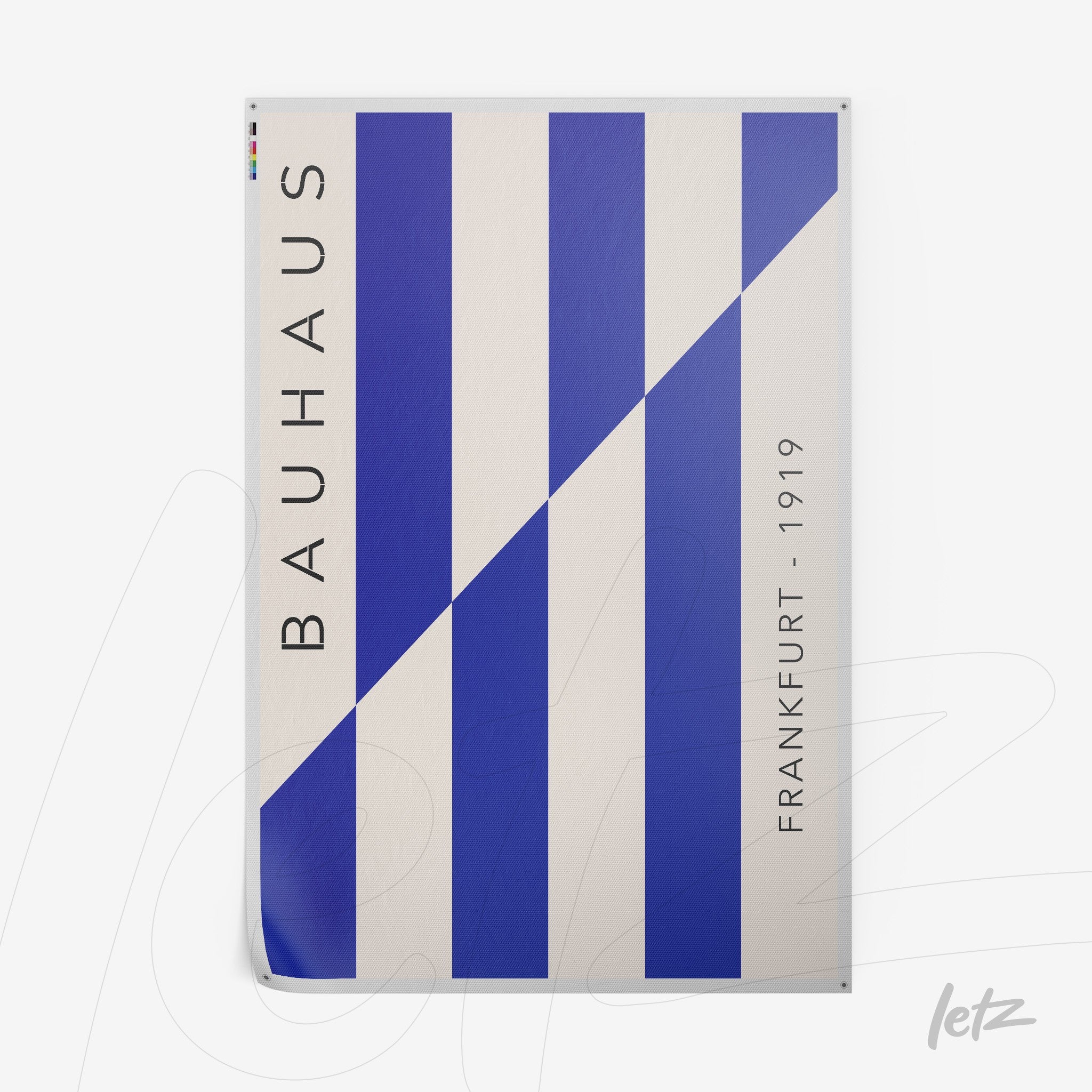 printed poster featuring geometric design in blue and white, vertical text with the word 'bauhaus' on the left and 'frankfurt - 1919' on the right