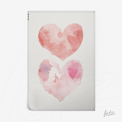 framed artwork featuring watercolor illustration of two hearts in pink shades on a light background