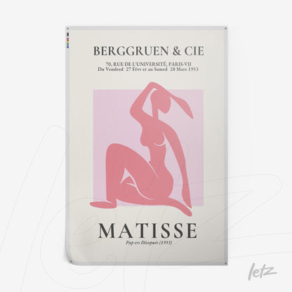 modern style wall art featuring a pink silhouette of a seated woman with a white frame and light background