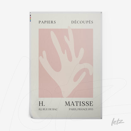framed artwork featuring an abstract hand design on a light pink background with subtle text in a white frame
