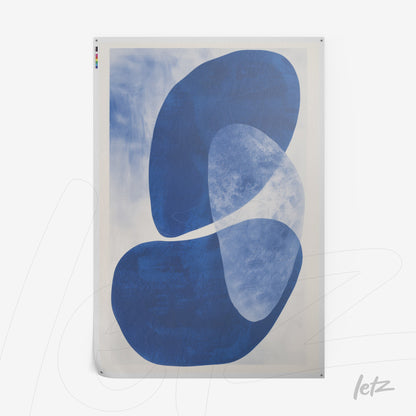 abstract wall art in shades of blue on light background