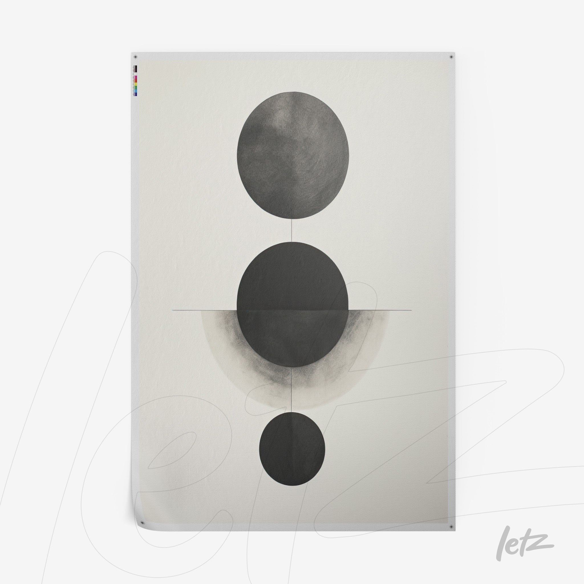abstract wall art featuring black and white geometric circles on a light background