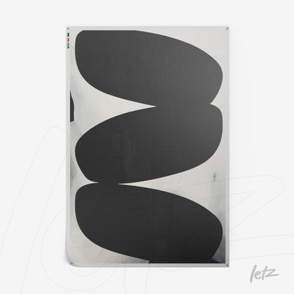 canvas artwork featuring abstract black shapes on a light background