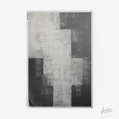 canvas artwork featuring abstract design in shades of black, white, and gray with soft textures