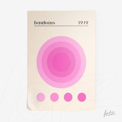 poster print featuring concentric circles in shades of pink on a light beige background with text 'bauhaus 1919' at the top