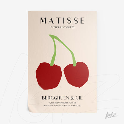framed wall art featuring cut-out style red apples on a light background with the word Matisse at the top