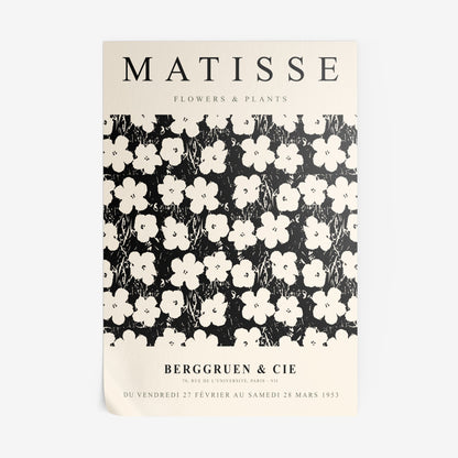 vintage style wall art featuring white flowers on a black background with uppercase text and a light frame