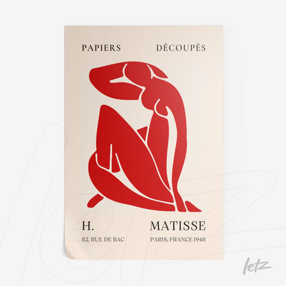 framed art featuring red cut-out design of a female figure on a light background with classic font text