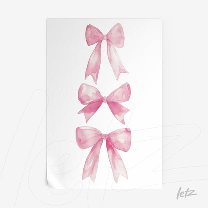 framed art featuring pink watercolor bows arranged vertically on a white background