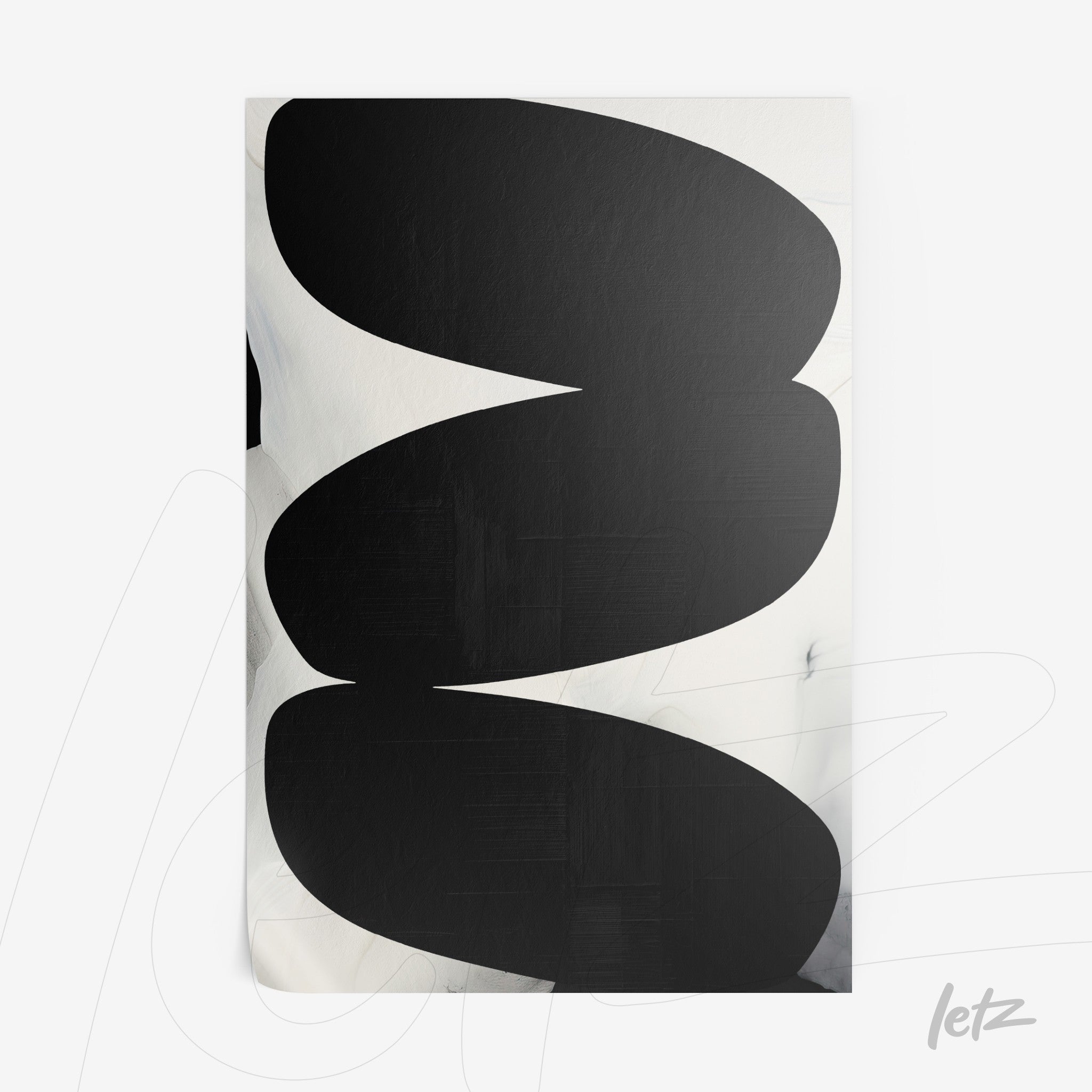 abstract wall art in black and white featuring large oval shapes on soft background