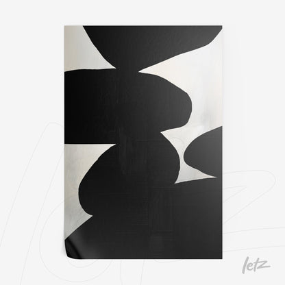abstract wall art featuring black organic shapes on a light background